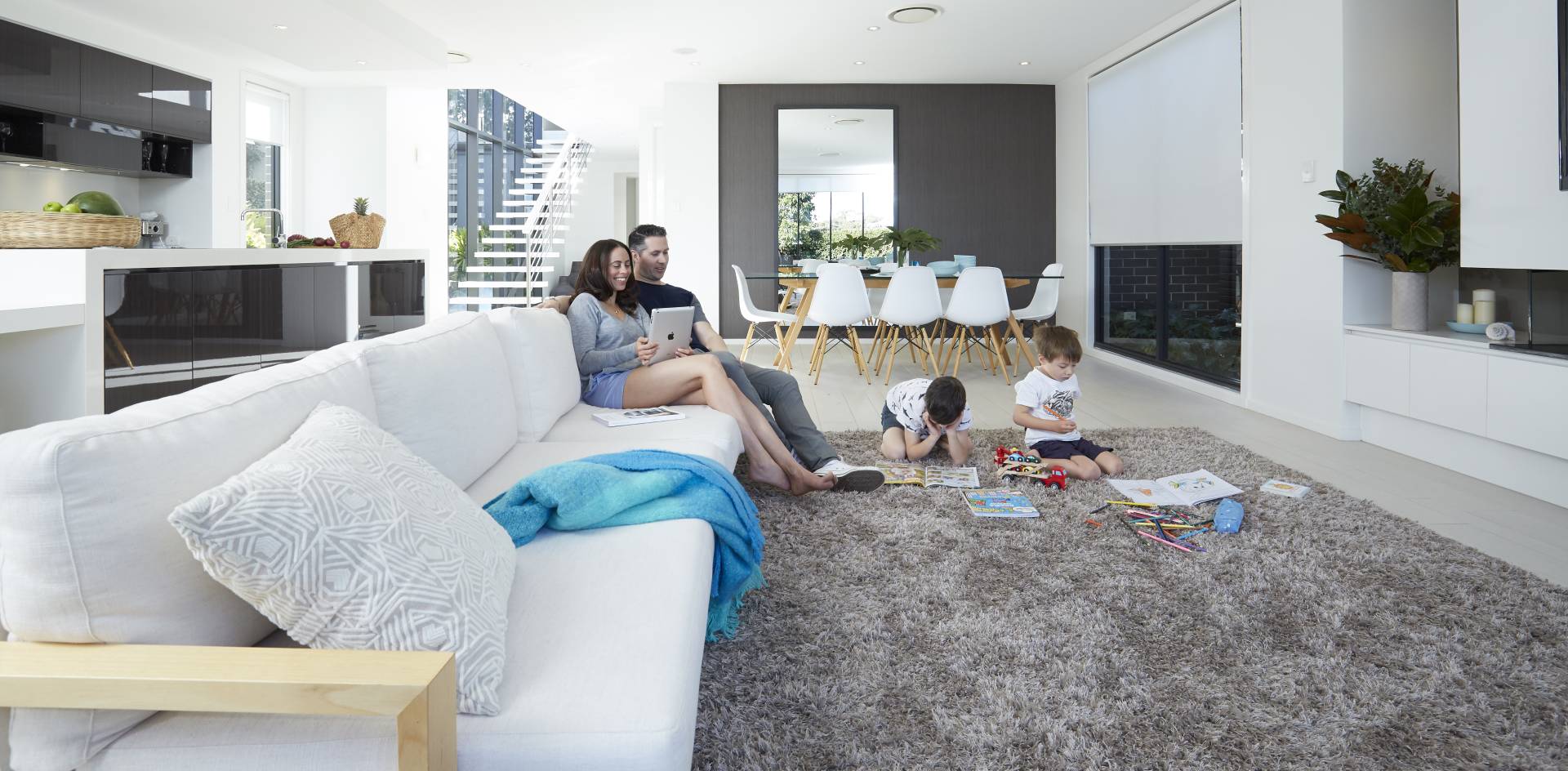 A family of four enjoy their Daikin air conditioning system in their home.